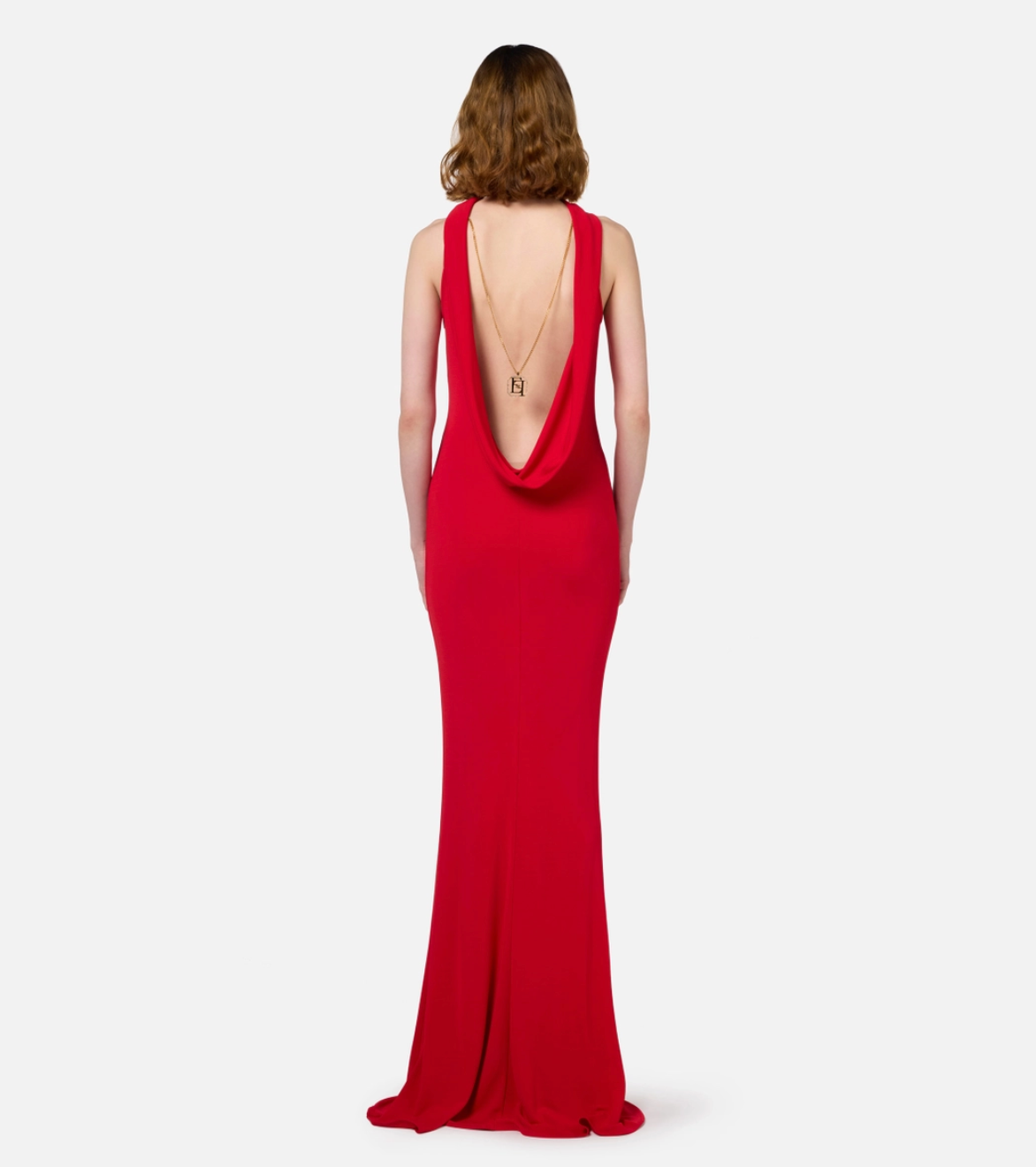 Red carpet dress in jersey with necklace on the back