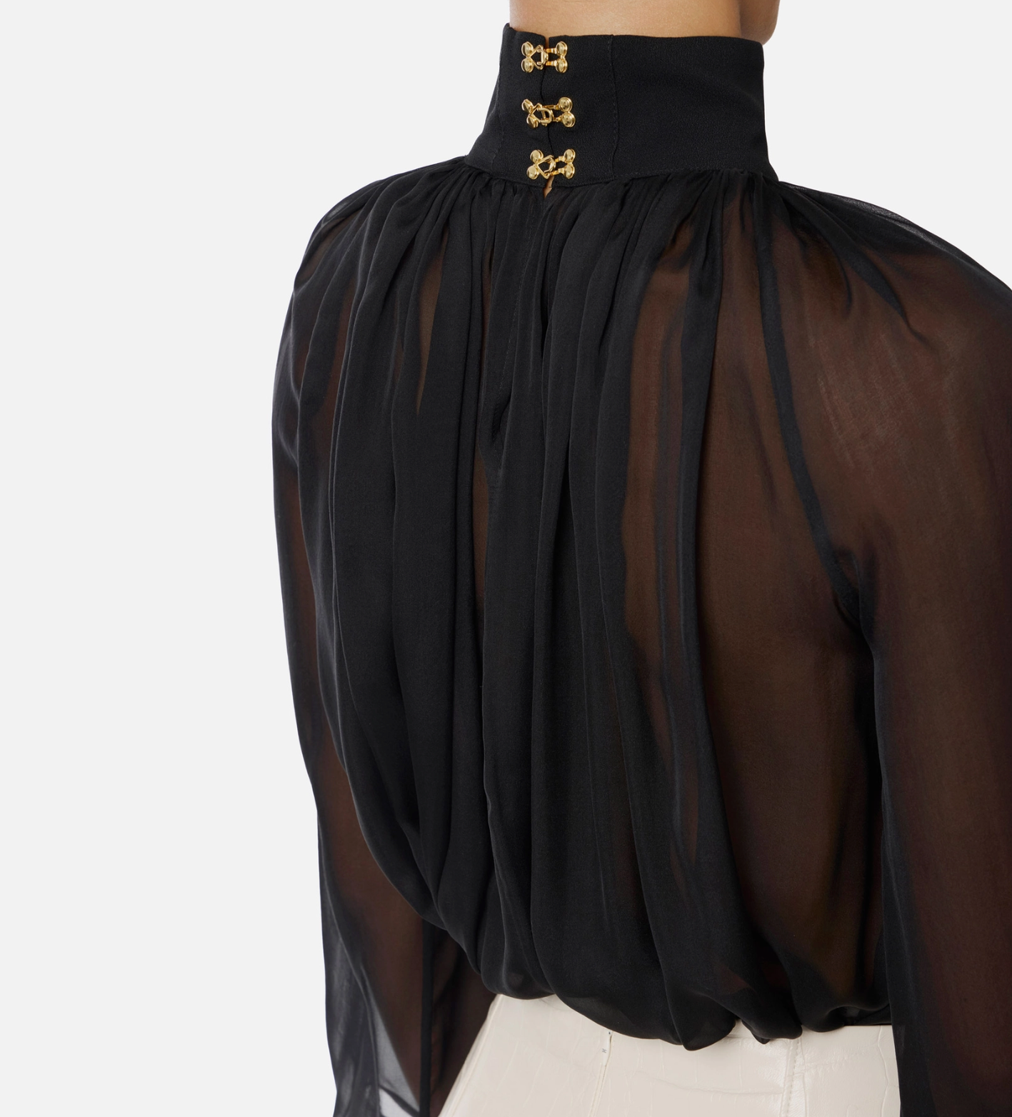 Blouse in voile fabric with jewel clasps
