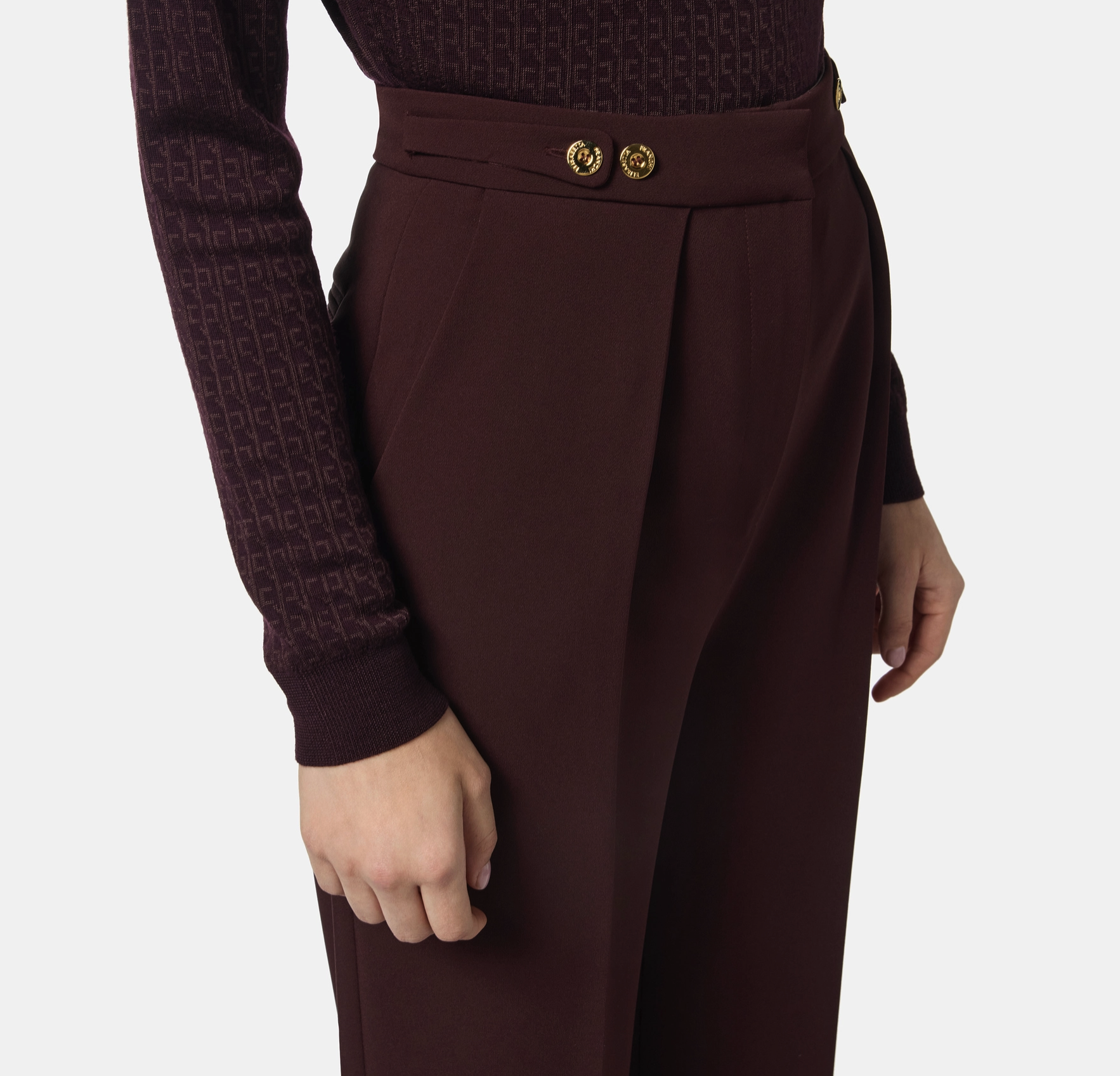 Trousers in crêpe fabric with jewel accessory