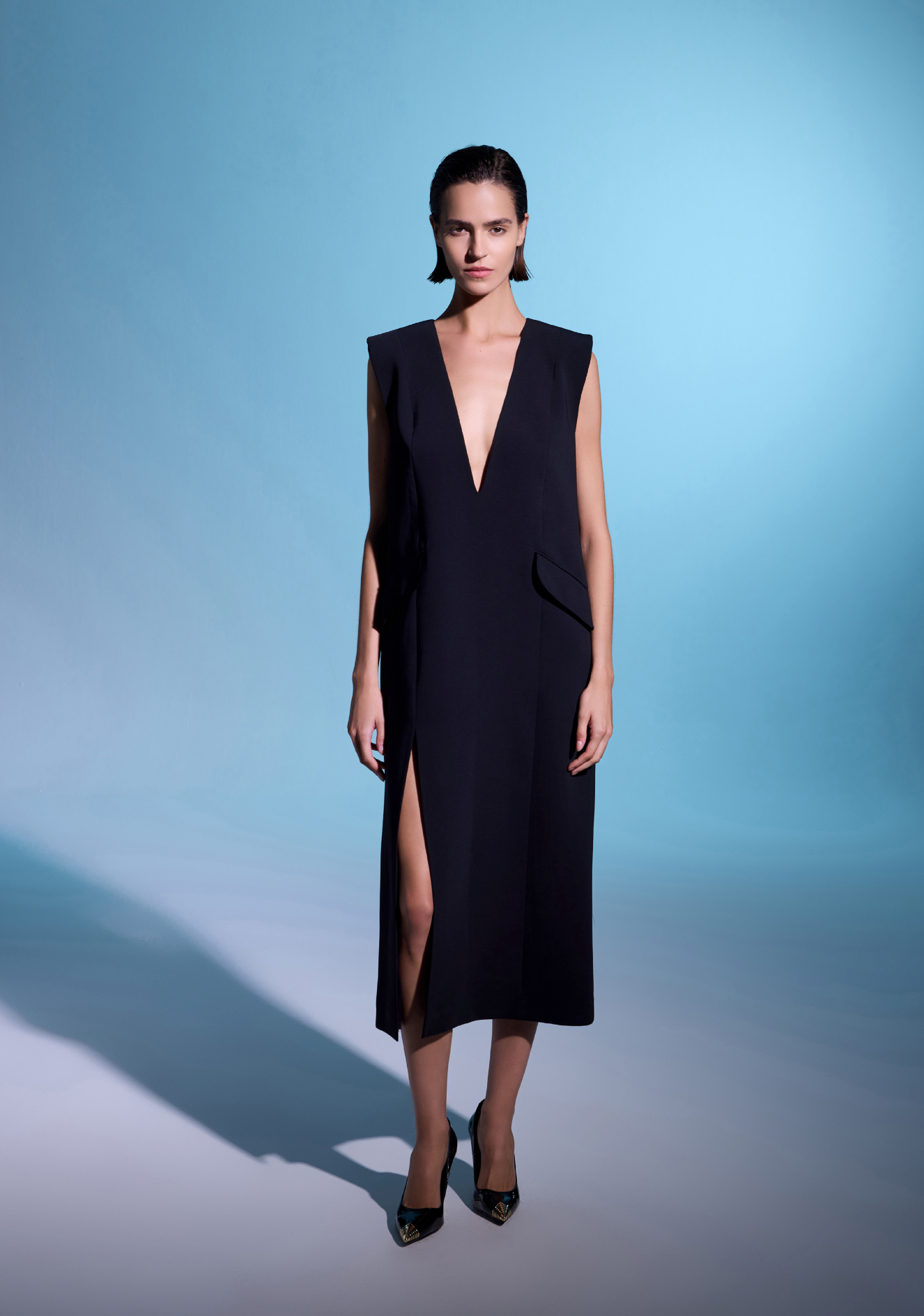 Sleeveless deep V dress with slit