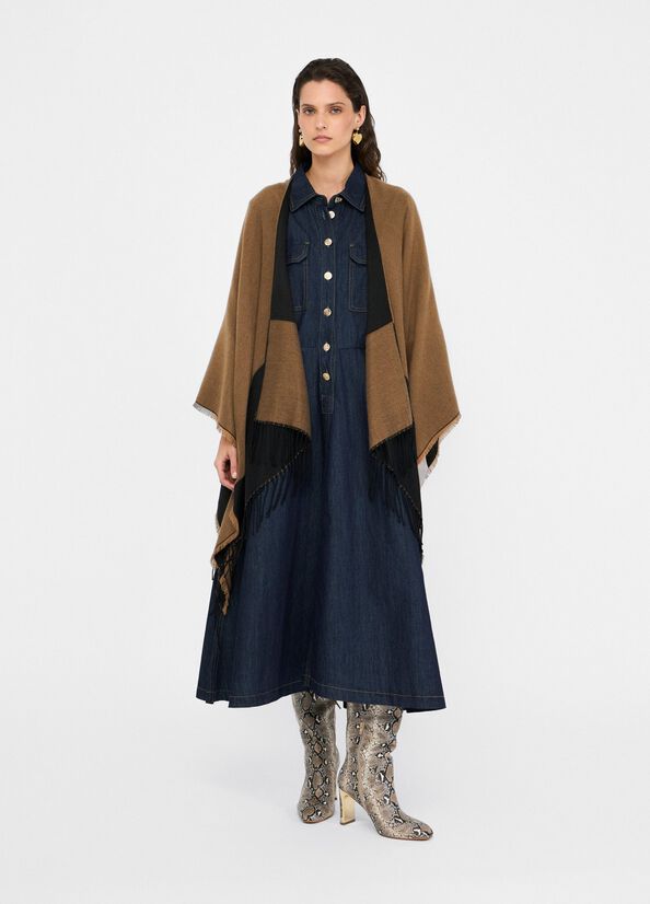 Poncho with logo and fringes