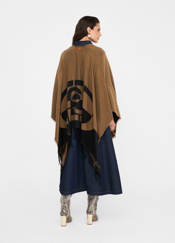 Poncho with logo and fringes